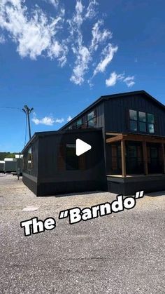 a black building with the words the barndo on it's front and side