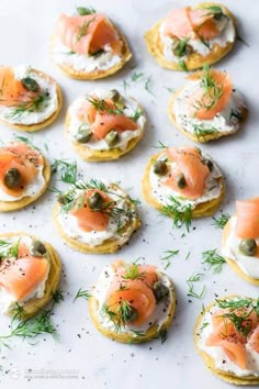 small crackers topped with smoked salmon and cream cheese