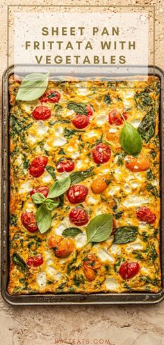 a sheet pan filled with vegetables on top of a table