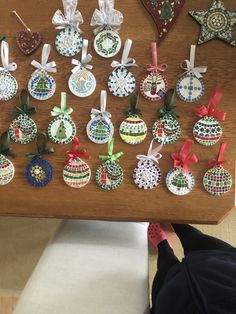 a wooden table topped with lots of ornaments