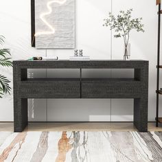 a living room scene with focus on the console table and potted plant in the corner