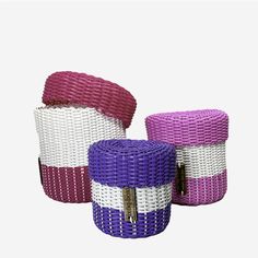 three different colored baskets sitting next to each other