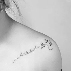 a woman's upper back shoulder tattoo with the word love and two birds