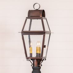 This beautifully crafted Independence Outdoor Post Light will enhance the beauty of your home. The historic glass adds to the splendor of this light. Five year guarantee.  Measures 27-Inches high and 12.25-Inches wide and 12.25-Inches deep E12/Candelabra sockets, 3 x 60 watts maximum wattage UL-CUL listed for damp locations, Solid Copper; Historic Glass; Blackened Solder; Lacquer coating for protection from the elements; Finish will darken over time but will not get verdigris Made in the USA Bul Primitive Wood Signs, Tin Panel, Primitive Walls, Flameless Tea Lights, Wooden Arrows, Long Table Runner, Lamp Finial