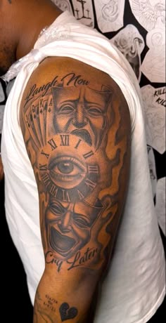 a man with a tattoo on his arm that has an evil face and all seeing eyes