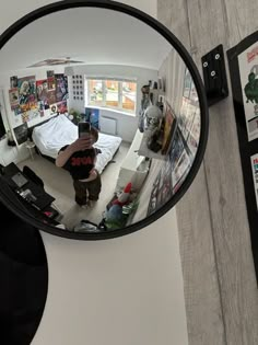 a person is taking a photo in the mirror