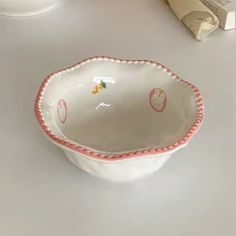 a white bowl sitting on top of a table