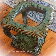 an old wooden table is painted green and has been turned into a side table for the living room