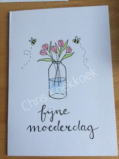 a card with some flowers in a jar