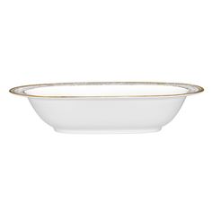 an empty white bowl with gold trimmings on the rim and bottom, against a white background