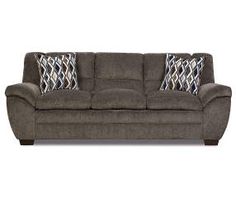 a gray couch with two pillows on it