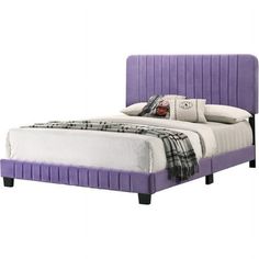 a bed with purple upholstered headboard and foot board