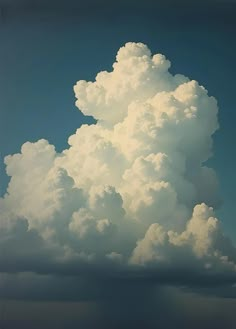 a large cloud is in the sky with some clouds above it and a boat on the water below