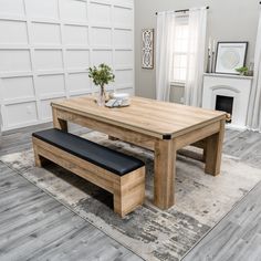 a wooden table and bench in a living room