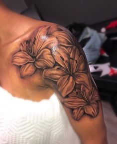 a woman's arm with flowers on it