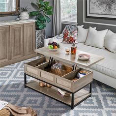 a living room with a couch, coffee table and other items on the floor in it