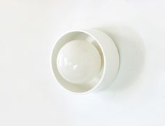 a white bowl sitting on top of a table