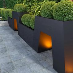 some very nice looking planters with lights in them