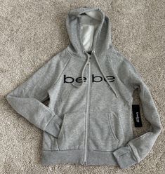 BEBE SPORT GRAY LOGO HOODED SWEATSHIRT  SIZE SMALL NEW WITH TAGS Athleisure Hoodie Sweatshirt With Logo Detail, Sporty Hoodie Top With Logo Detail, Sporty Hoodie Top With Logo, Sporty Hoodie With Logo Detail, Winter Athleisure Sweatshirt With Logo, Winter Loungewear Sweatshirt With Logo, Athleisure Crew Neck Hoodie With Logo, Gray Crew Neck Sweatshirt With Logo, Fall Hoodie With Logo Detail For Loungewear