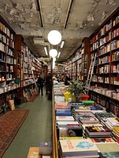 a long row of bookshelves filled with lots of books