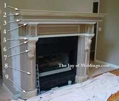 the fireplace is being painted with white paint and features numbers on each side to indicate where it was built