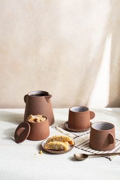 Canyon Clay Cup and Saucer shown with whole set by Citrine along with sugar cubes and desert. Bohemian Dishes, Dinnerware Sets Rustic, Pottery Photography, Pottery Projects, Clay Cup, Lighting Decor, Ceramic Ideas, Morning Ritual, Tableware Set