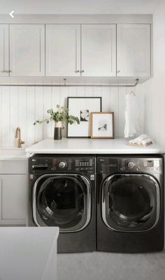 a washer and dryer in a white laundry room