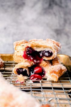 blueberry crumbs and powdered sugar on a cooling rack