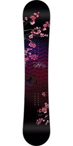 the snowboard is decorated with pink flowers and black lettering on it's side