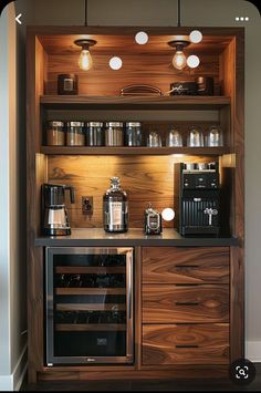 a coffee maker is on top of a wooden cabinet