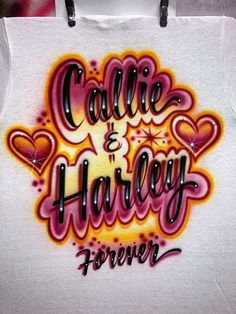 a white t - shirt with the words cake and harley on it