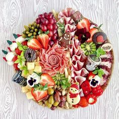 a platter filled with lots of different types of fruits and vegtables