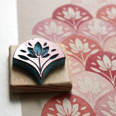 a wooden stamp with a flower design on it