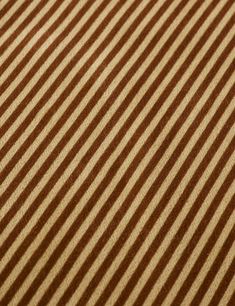 a close up view of a brown and white striped fabric