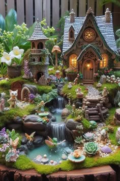 a small garden with lots of plants and animals on it's sides, including a waterfall