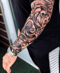 a man with a tattoo on his arm