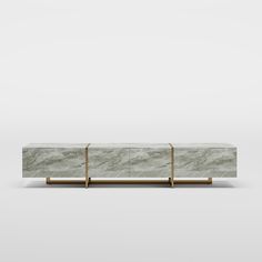 the sideboard is made out of marble with brass handles and two sections on each side