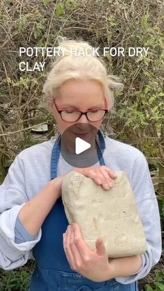 a woman holding a rock in her hands with the caption pottery hack for dry clay