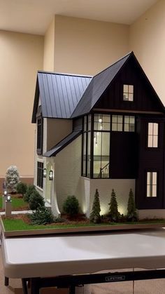 a model house is displayed on a table