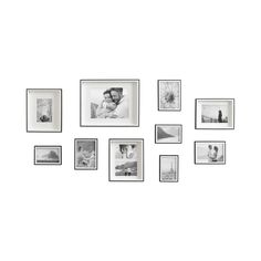 black and white photo frames arranged on the wall