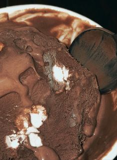 a bowl filled with ice cream and chocolate