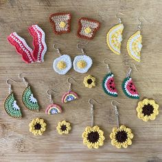 crocheted earrings and earring sets on a wooden table with watermelon