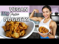 a woman holding a bowl filled with chicken nuggets