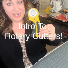 a woman holding up a yellow scissors in her hand with the words, learn how to use rotary cutters