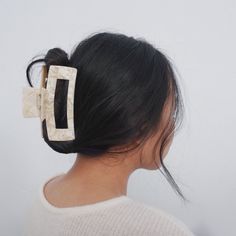 "Minimalist Hair Claw Clip Our best selling hair claw is back in stock! A large, oversized hair claw that's perfect for all hair types. Available in Classic Tortoise Shell, Blond Tortoise Shell, Pearl, Rose Quartz, Confetti, and Jade. Perfect for thick hair, French twists, sleek updos, or minimalist 90's vibes. 🛋 Immediately elevate your lazy day look. 💅🏻 Feel put together and polished while working from home. 🥐 A must-have for French girl hair. 🦋 The ultimate Y2K hair accessory. 📸 As seen Y2k Hair Accessories, French Girl Hair, Thick Long Hair, Selling Hair, Hair French, 90's Vibes, Minimalist Hair, Y2k Hair, French Twists