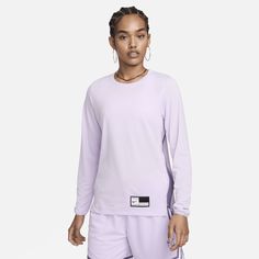 Bring your focus to the basketball court in this sweat-wicking warm-up top. Its lightweight fabric combines with an easy fit so you can pass and pivot feeling free. Nike Athleisure Tops For Sports Events, Purple Athleisure Tops For Sports, Nike Sweat Resistant Tops For Sports Season, Nike Functional Streetwear Tops, Nike Go-dry Top For Streetwear, Purple Moisture-wicking Activewear For Sports Events, Purple Casual Tops For Sports Events, Nike Athletic Fit Sweat Resistant Top, Purple Moisture-wicking Top For Sports Events