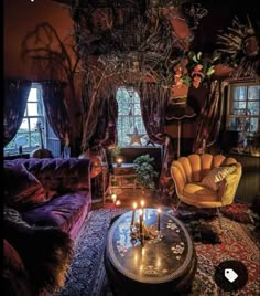 a living room filled with lots of furniture and candles on top of a coffee table