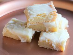 four pieces of cake sitting on top of a plate