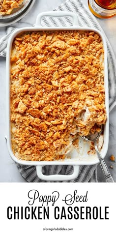 a casserole dish filled with chicken and topped with crumbs