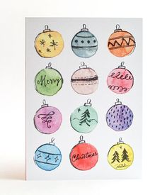 a christmas card with watercolor ornaments on it